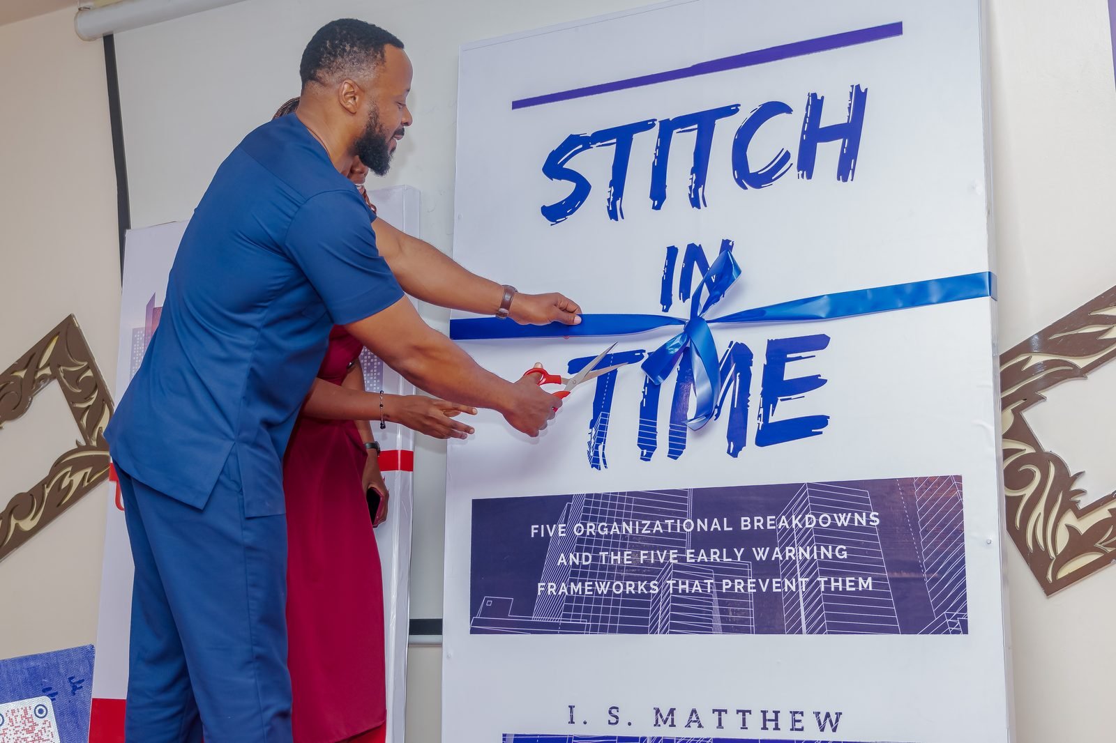 Cutting the ribbon to launch Stitch In Time at the 5M Leadership book launch